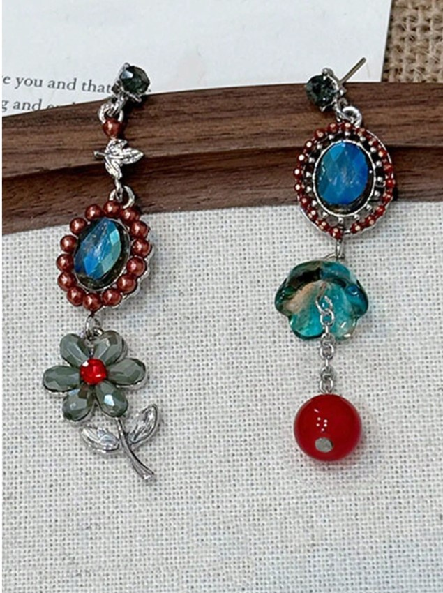 Gothic Garden Drop Earrings styled on wood and linen